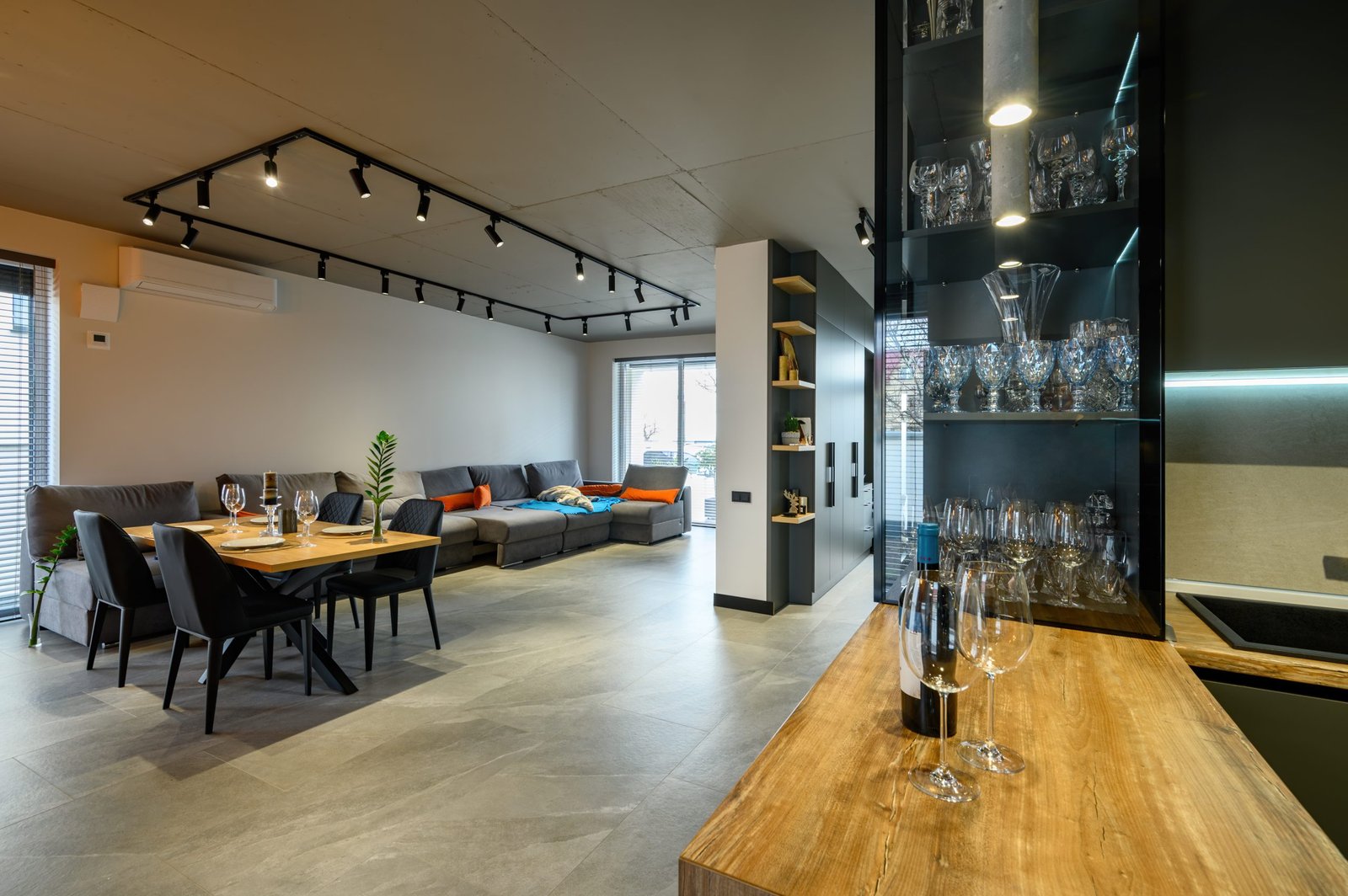 Modern luxury loft studio apartment interior with dining table in large living room