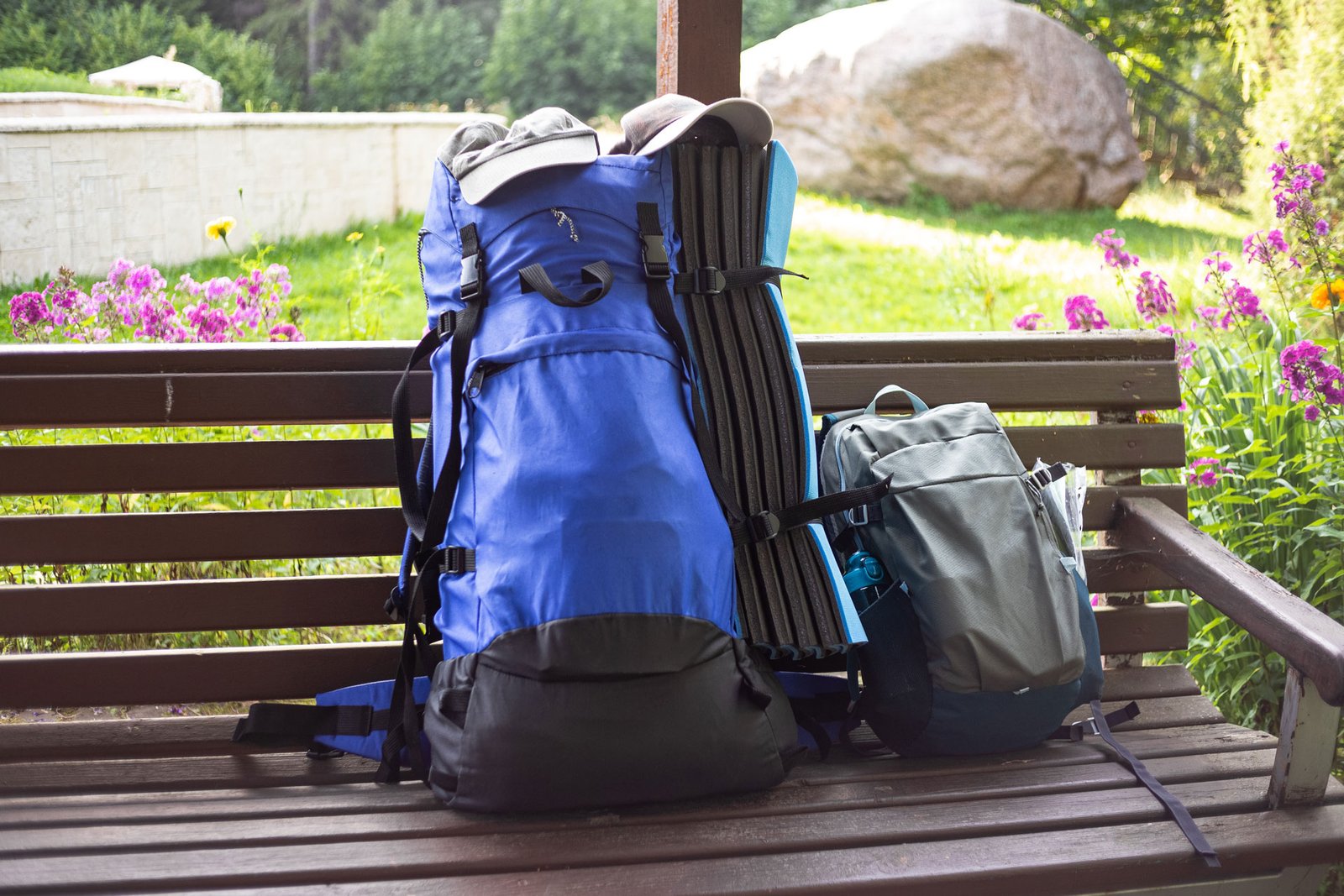 on-a-sunny-summer-day-two-hiking-backpacks-on-a-p-2026-01-05-05-10-08-utc